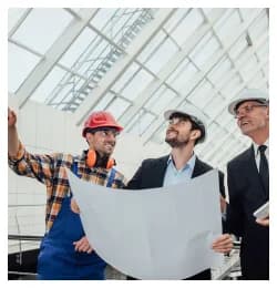 Engineers reviewing plans